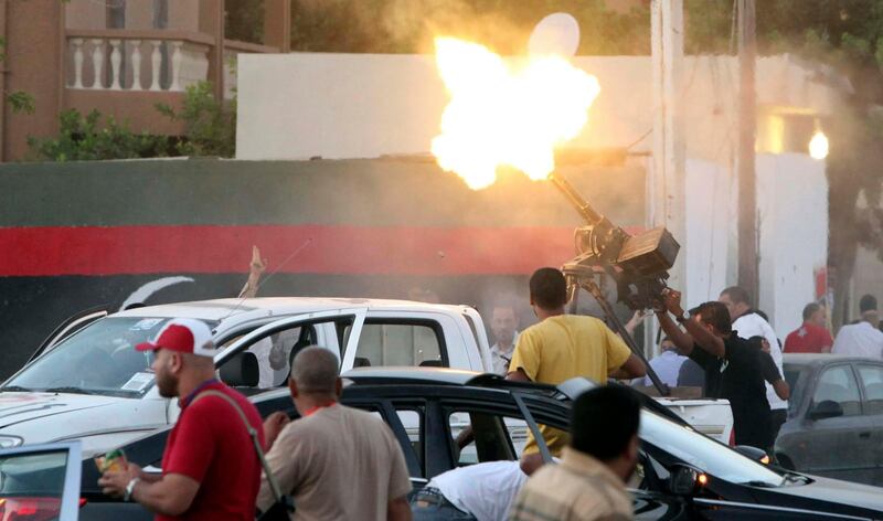 An anti-Gaddafi fighter opens fire in Tripoli September 20, 2011.  REUTERS/Ismail Zitouny (LIBYA - Tags: CONFLICT) *** Local Caption ***  ISM01_LIBYA-_0920_11.JPG