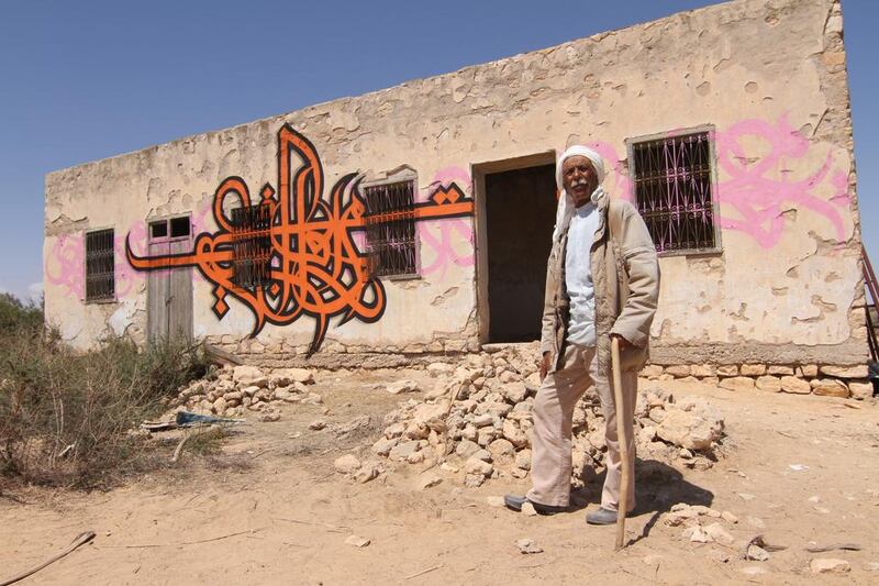 Photos of El Seed from his upcoming book, Lost Walls. This is in Tunisia.

CREDIT: Courtesy El Seed