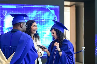 Graduates meet with family and friends after the Mohamed bin Zayed University of Artificial Intelligence (MBZUAI) inaugural commencement ceremony in Abu Dhabi. Khushnum Bhandari / The National 
