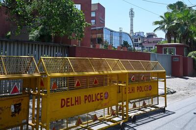 Police barricades are seen in front of the gate of the Twitter India's office at Crescent building in New Delhi on May 25, 2021, as police served a notice at Twitter's offices over flagged governments tweets as 'manipulated media' a day before. / AFP / Prakash SINGH
