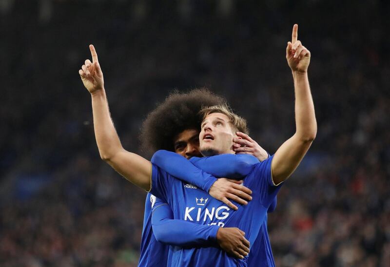 Leicester City's Marc Albrighton celebrates scoring their first goal with Choudhury. Action Images via Reuters