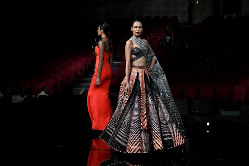 Models present colourful creations by designer Amit Aggarwal.