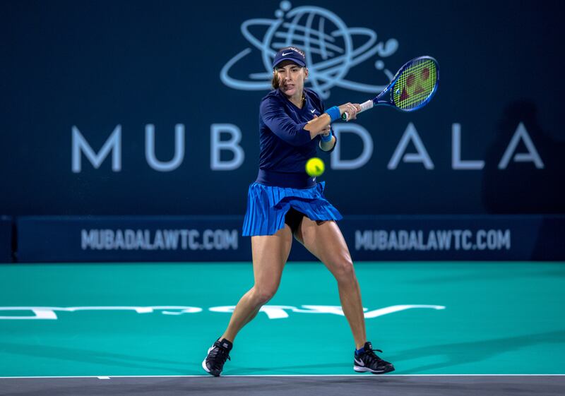 Belinda Bencic hits a forehand to Ons Jabeur during the Mubadala World Tennis Championship at the International Tennis Centre, Zayed Sports City, Abu Dhabi on December 16, 2021. Victor Besa / The National