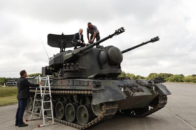 German Chancellor Olaf Scholz aboard a Gepard anti-aircraft tank of the type sent to Ukraine. Getty