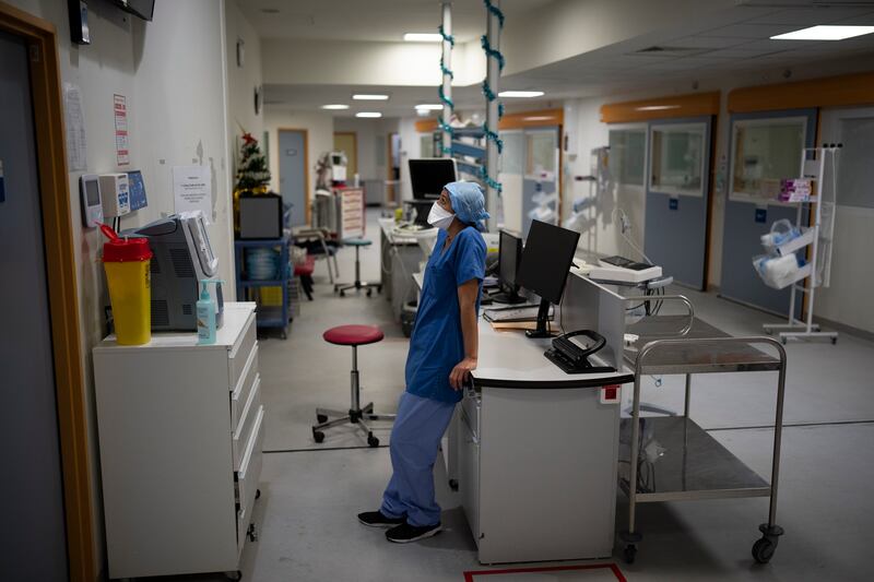 A nurse waits for a blood sample analysis in the Covid-19 intensive care unit at La Timone Hospital in Marseille, southern France. AP