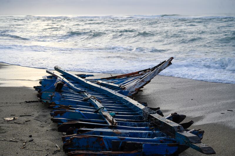A view of the wreckage of a capsized boat that was washed ashore at a beach near Cutro, southern Italy. AP