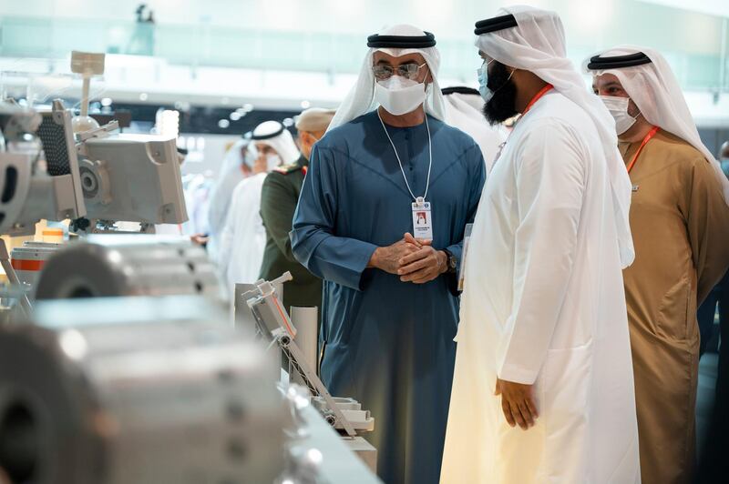 ABU DHABI, UNITED ARAB EMIRATES - February 22, 2021: HH Sheikh Hamed bin Zayed Al Nahyan, Member of Abu Dhabi Executive Council (L) tours the International Defence Exhibition and Conference (IDEX), at ADNEC. Seen with Faisal Al Bannai, Chief Executive and Managing Director of EDGE (back R).

( Rashed Al Mansoori / Ministry of Presidential Affairs )
---