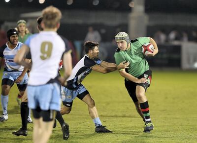 Dubai, United Arab Emirates - December 05, 2019: Stanislas Provot of Al Yasmina takes on the BSAK defence in the match between BSAK and Al Yasmina in the U19 boys at the HSBC rugby sevens series 2020. Thursday, December 5th, 2019. The Sevens, Dubai. Chris Whiteoak / The National