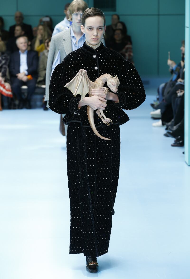 For the same autumn/winter 2018 show, one model tenderly clutched a 'baby dragon' as she walked the runway. Photo: Gucci