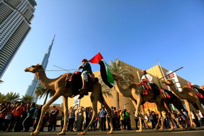 Dubai, United Arab Emirates-December 02, 2012;  Dubai residents participate in the Parade  to mark the UAE's 41st National Day at the Burj Downtown in  Dubai . (  Satish Kumar / The National ) For News
