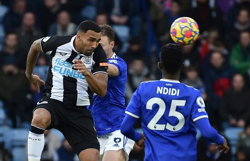 Newcastle's Callum Wilson and Leicester's Jonny Evans challenge for the ball. AP