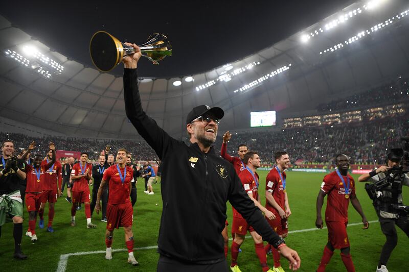 Jurgen Klopp celebrates with the Club World Cup after the win over CR Flamengo December 21, 2019 at the Khalifa International Stadium in Doha, Qatar. Getty
