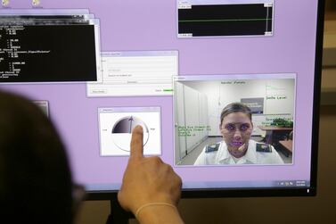 A computer monitors some of cadet Cheyenne Quilter's reactions as she works with a virtual reality character named "Ellie" at the US Military Academy at West Point, NY. AP