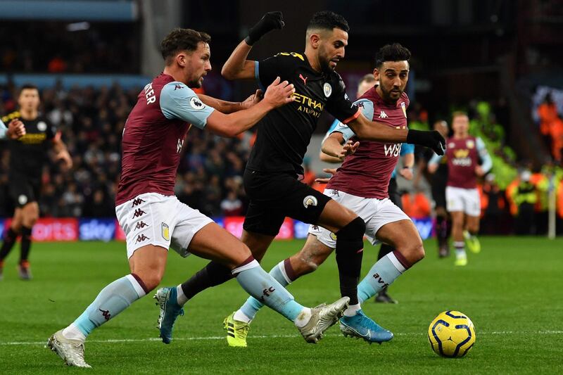 Manchester City's Riyad Mahrez, centre, weaves his way through the Aston Villa defence to score at Villa Park. AFP