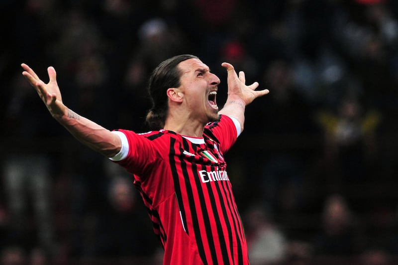(FILES) In this file photo taken on February 15, 2012 AC Milan's Swedish forward Zlatan Ibrahimovic kicks and score a penalty during the UEFA Champions League round of 16 first leg match AC Milan vs Arsenal at San Siro stadium in Milan. Swedish star Zlatan Ibrahimovic has signed a six-month contract with Serie A side AC Milan with the option of an additional year, the Italian club said in a statement on December 27, 2019. Ibrahimovic played for two seasons between 2010 and 2012 with Milan, helping them to their last Serie A title. The 38-year-old left Los Angeles Galaxy last month following the club's elimination from the Major League Soccer playoffs.
 / AFP / Giuseppe CACACE

