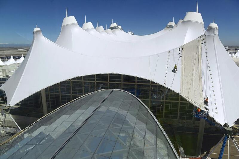 The tents that crown the Denver airport’s main terminal are meant to mimic the surrounding mountains. Work to reconfigure the terminal is ongoing. Andy Cross / Getty Images