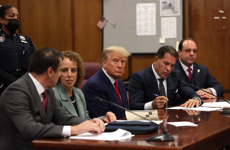 Former US President Donald Trump in the courtroom with his defence team for his arraignment in New York Criminal Court in New York, on April 4. EPA