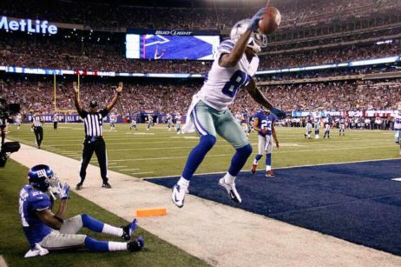Dallas Cowboys wide receiver Kevin Ogletree celebrates his second touchdown against the NY Giants.