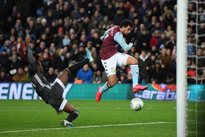 Mahmoud Trezeguet avoids the challenge of Ricardo Perreira to score the winning goal during the League Cup semi final at Villa Park. Getty Images