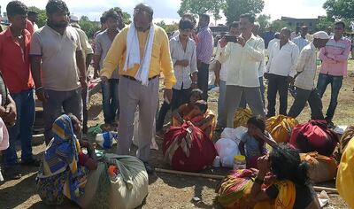 This photo taken on July 1, 2018 shows Indian village leaders speaking to the relatives of men killed in a lynching incident in Dhule district, some 330 kilometres (205 miles) from Mumbai. Indian police said July 2 they have arrested 23 people after five men were bludgeoned to death by a crazed mob in yet another horrific lynching to rock the country.
 / AFP / -
