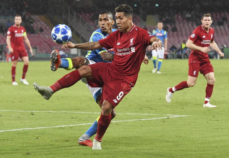 Napoli's Allan and Liverpool's Roberto Firmino in action. EPA