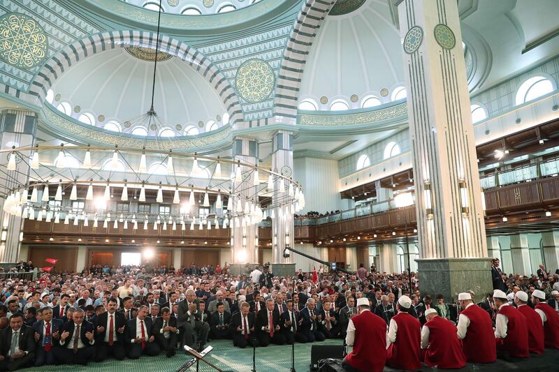 Turkish President Recep Tayyip Erdogan (back-C), praying on the third anniversary of the failed coup attempt at the Millet (Nation) mosque in Ankara, Turkey.  EPA