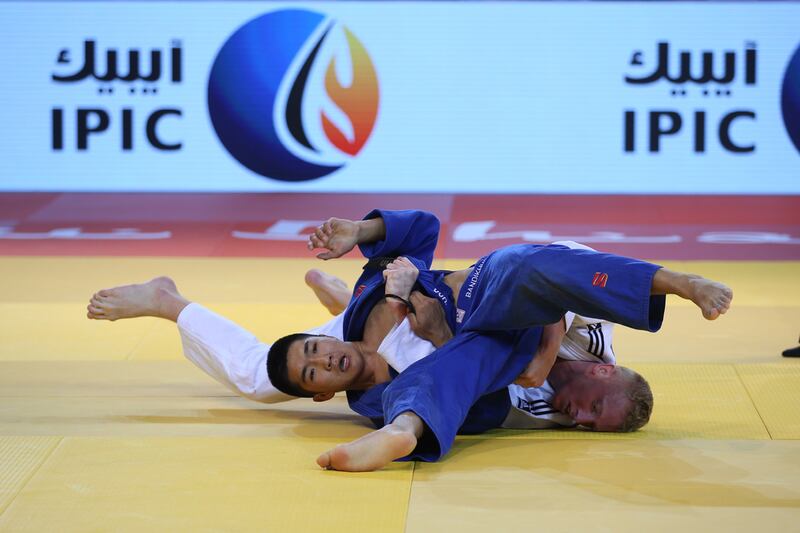 Netherlands top seed Frank di Wit, in white, defeated Mongolia’s Baterdene Bandhikuu in the semi-final before going on to win the title in the 81kg category. Adil Al Naimi / Ittihad