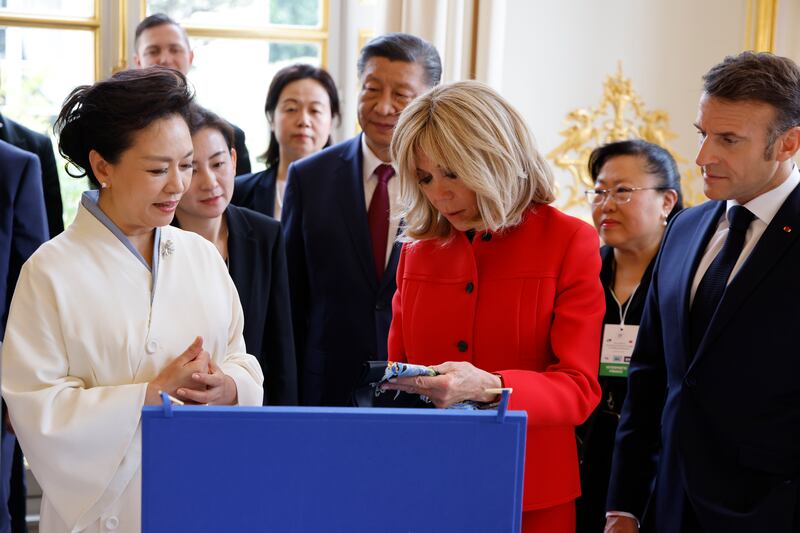 The Chinese and French presidential couples exchange gifts on behalf of their countries at the Elysee Palace. EPA