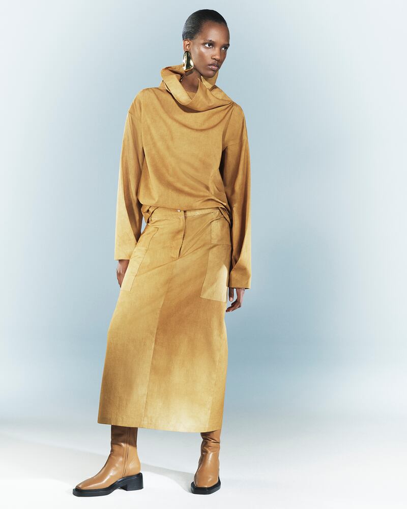 A funnel neck top and skirt in washed sand and large, almost utilitarian, pockets