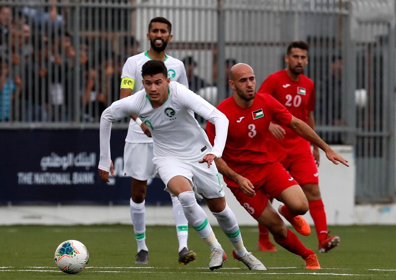 Saudi player Abdullah Abdulrahman Alhamddan views for the ball with Palestinian player Mohammed Rashid during a World Cup 2022 Asian qualifying match between Palestine and Saudi Arabia in the town of al-Ram in the Israeli occupied West Bank. The game would mark a change in policy for Saudi Arabia, which has previously played matches against Palestine in third countries. Arab clubs and national teams have historically refused to play in the West Bank, where the Palestinian national team plays, as it required them to apply for Israeli entry permits. AFP