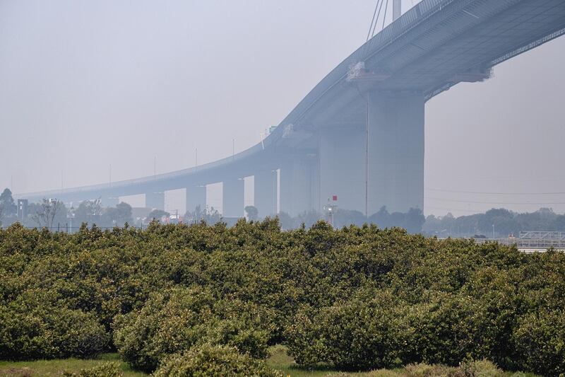 The West Gate bridge is shrouded in smoke as hazardous air quality and bushfire smoke blankets the city in Melbourne, Australia.  Getty