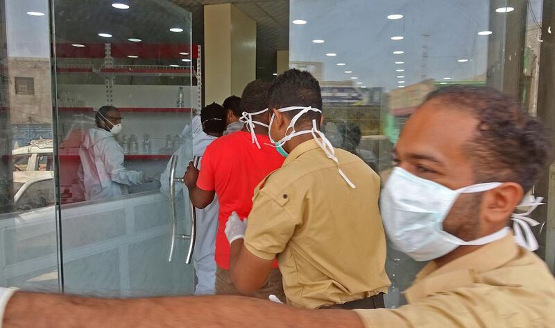 Health workers enter the Al Kubi Hospital in Yemen's southern coastal city of Aden. AFP