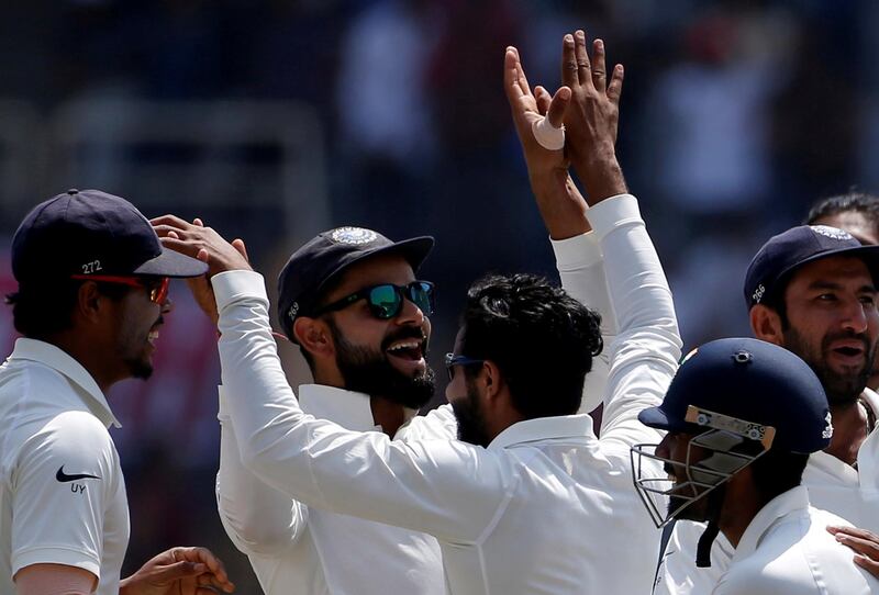 FILE PHOTO: Cricket - India v Australia - Third Test cricket match - Jharkhand State Cricket Association Stadium, Ranchi, India - 20/03/17 - India's captain Virat Kohli (C) celebrates the dismissal of his Australian counterpart Steven Smith with his teammates. REUTERS/Adnan Abidi/File Photo