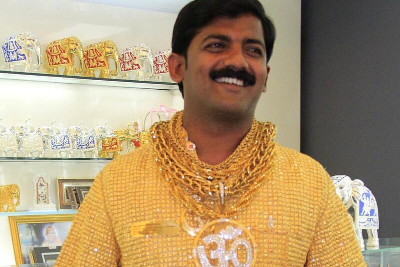 In this photograph from January 31, 2013, Indian businessman Datta Phuge poses in a shirt made of gold, worth 12.7 million rupees or, US $240,000. The shirt weighs 3.32 kilogrammes. AFP 