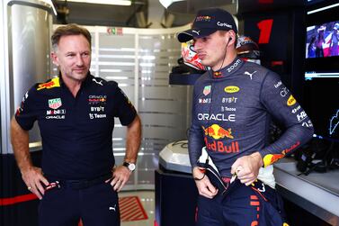 AUSTIN, TEXAS - OCTOBER 21: Max Verstappen of the Netherlands and Oracle Red Bull Racing and Red Bull Racing Team Principal Christian Horner look on from the garage during practice ahead of the F1 Grand Prix of USA at Circuit of The Americas on October 21, 2022 in Austin, Texas.    Mark Thompson / Getty Images / AFP