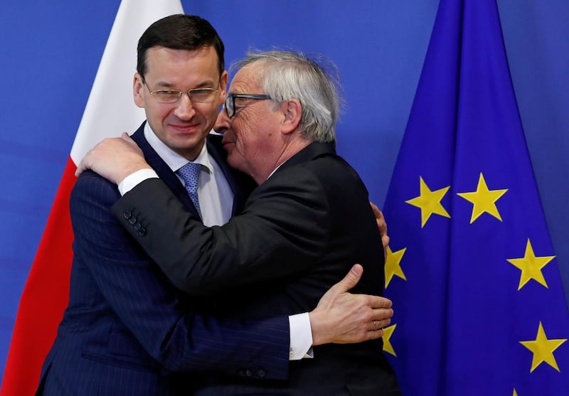 Poland's Prime Minister Mateusz Morawiecki is welcomed by European Commission President Jean-Claude Juncker in Brussels, Belgium, March 8, 2018.   REUTERS/Yves Herman     TPX IMAGES OF THE DAY
