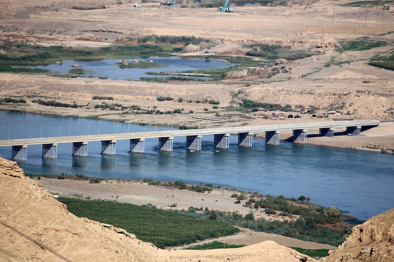 A bridge spans the Tigris river near the Makhoul dam site, in northern Iraq's Salaheddine province. AFP