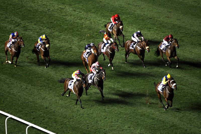 March 30, 2013 (Dubai) Jockeys race during the Al Quoz Sprint at the Dubai World Cup March 30, 2013. (Sammy Dallal / The National)