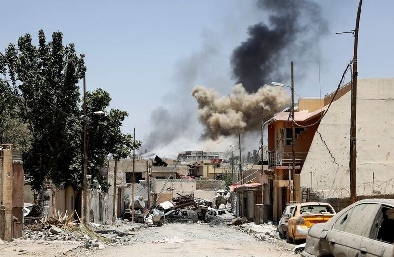 Smoke rises from clashes in the neighbourhood of Shifa, in western Mosul, Iraq on June 15, 2017 as the battle against ISIL continues. Erik De Castro/Reuters