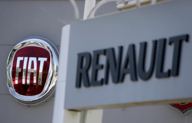 FILE PHOTO: The logos of Renault and Fiat carmakers are seen in Nice, France, June 3, 2019.    REUTERS/Eric Gaillard/File Photo