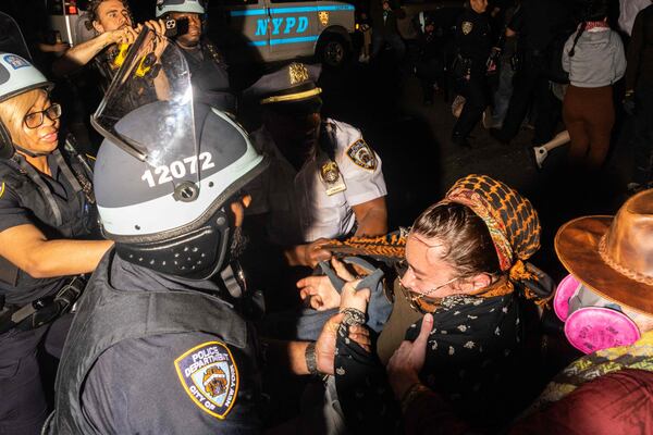 New York City police arrest demonstrators who were blocking the street after the clearing of a pro-Palestine camp at the Fashion Institute of Technology. Getty Images / AFP