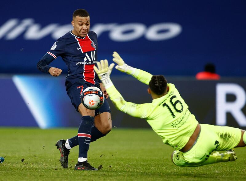 Paris St Germain's Kylian Mbappe scores their first goal against Montpellier. Reuters