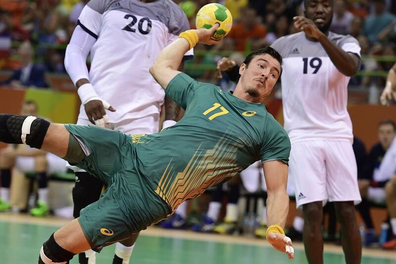 Brazil’s pivot Alexandro Pozzer jumps to shoot during the men’s quarter-final handball match against France. Javier Soriano / AFP
