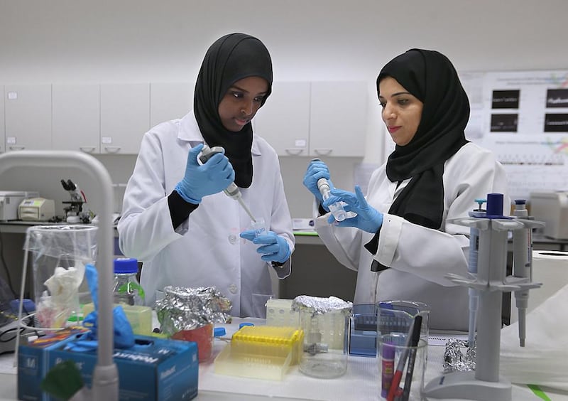 Dr Habiba Alsafar, right, works with a researcher at the Khalifa University Centre for Biotechnology. Delores Johnson / The National