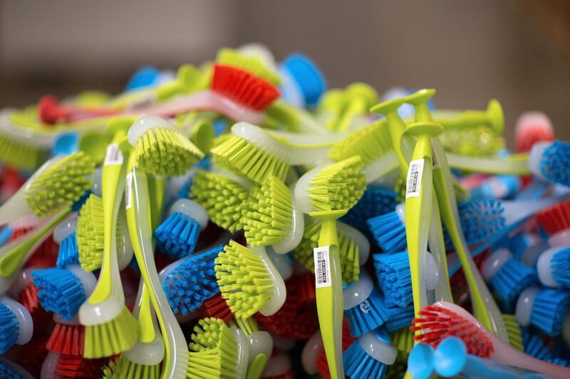 Brightly colored plastic kitchen cleaning brushes sit on display at an Ikea store. Andrey Rudakov / Bloomberg