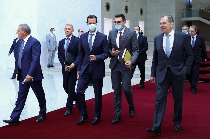 Russia's Deputy Prime Minister Yuri Borisov (L), Foreign Minister Sergei Lavrov (front R) and Syrian President Bashar al-Assad (C) walk during their meeting in Damascus on September 7, 2020. RESTRICTED TO EDITORIAL USE - MANDATORY CREDIT "AFP PHOTO / RUSSIAN FOREIGN MINISTRY / HANDOUT " - NO MARKETING - NO ADVERTISING CAMPAIGNS - DISTRIBUTED AS A SERVICE TO CLIENTS
 / AFP / RUSSIAN FOREIGN MINISTRY / Handout / RESTRICTED TO EDITORIAL USE - MANDATORY CREDIT "AFP PHOTO / RUSSIAN FOREIGN MINISTRY / HANDOUT " - NO MARKETING - NO ADVERTISING CAMPAIGNS - DISTRIBUTED AS A SERVICE TO CLIENTS

