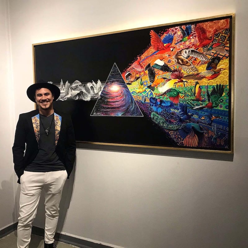 'Camilo Arias in front of his piece Unity of Diversity'.  Courtesy of the artist