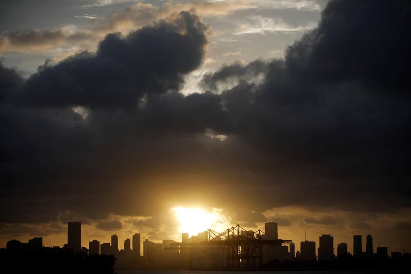 Dark clouds are seen over Miami's skyline prior to the arrival of Hurricane Irma to south Florida. Carlos Barria / Reuters