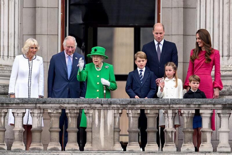 Charles and Camilla with Queen Elizabeth, Prince William, his wife Kate and their children George, Charlotte and Louis at the end of the Platinum Pageant in London as part of the queen's platinum jubilee celebrations. AFP