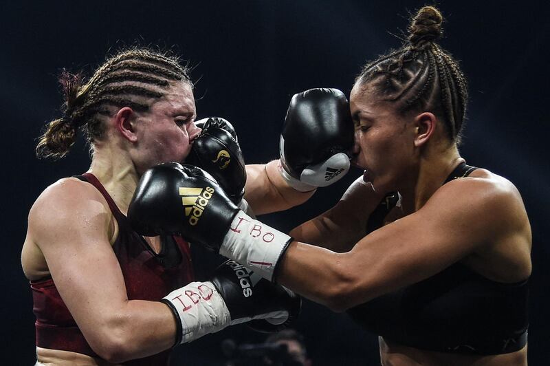 Germany's Verena Kaiser, left, and Estelle Yoka-Mossely of France during their IBO lightweight title fight at the H Arena in Nantes, western France, on Friday, March 5. Yoka Mossley won the bout on points. AFP